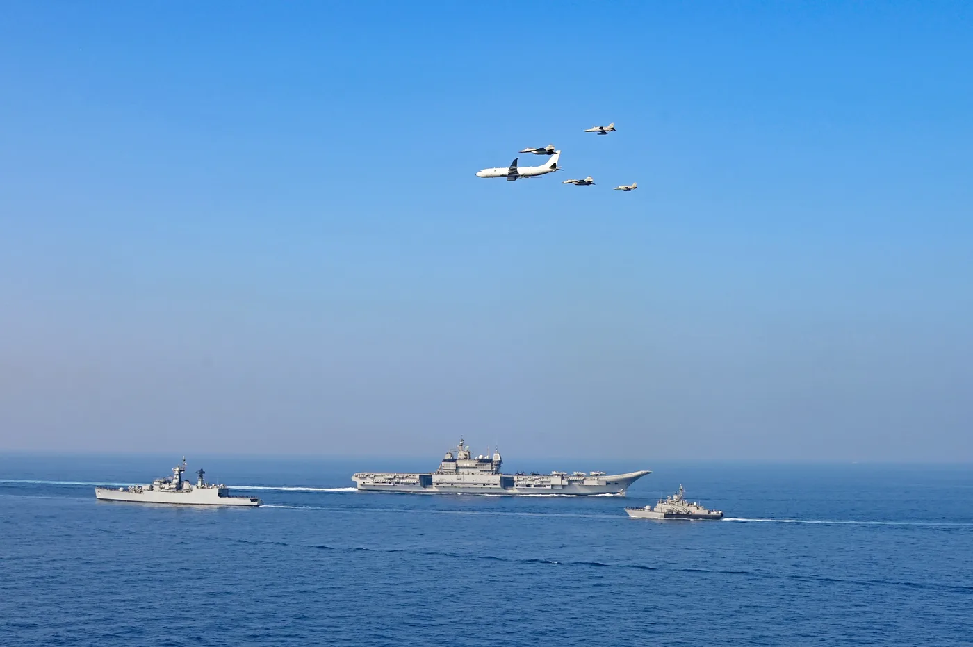 Indigenous Aircraft Carrier INS Vikrant steaming in Carrier Battle Group formation alongside frontline Indian Navy surface combatants, P-8I maritime patrol aircraft, and MiG-29K fighters